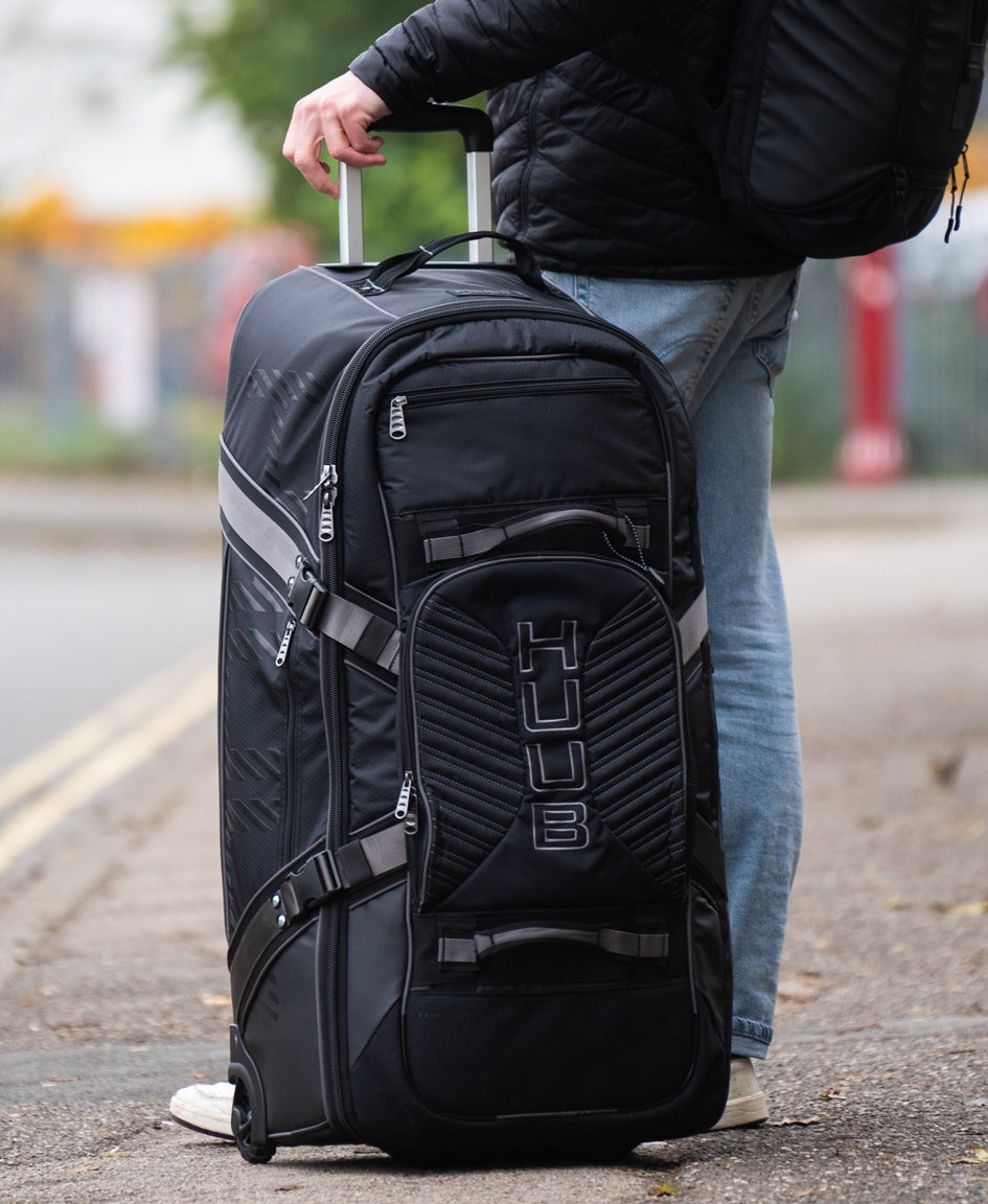 HUUB Travel Wheelie Bag – 95L, hard wheels, retractable handle, internal pockets, black pro athlete luggage
