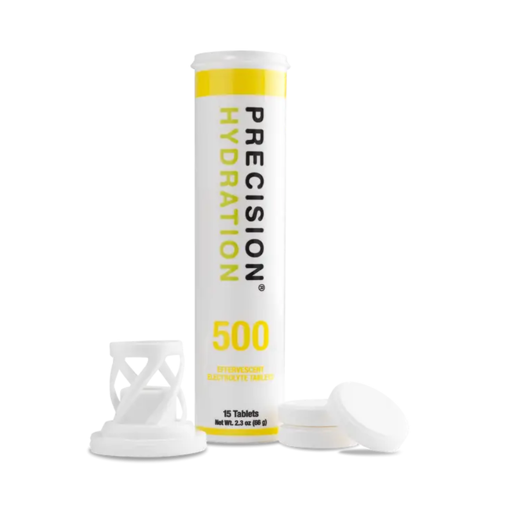 Precision Fuel & Hydration electrolyte drink tablets in a clear container with tablets ready to dissolve in water.