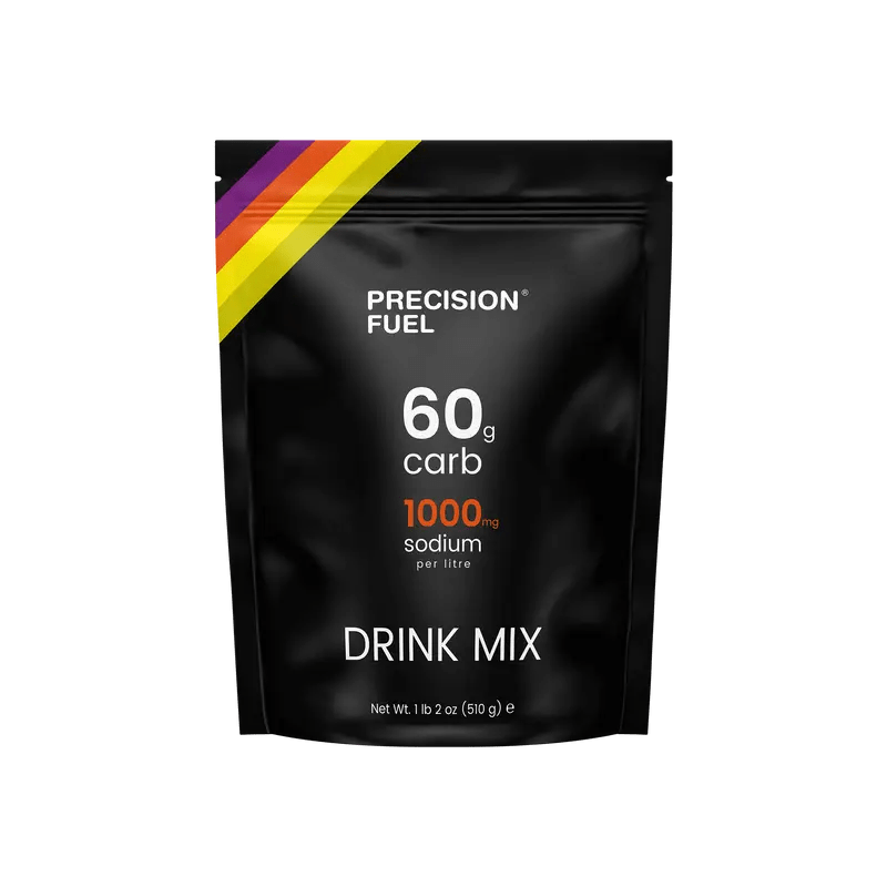 Precision Fuel & Hydration Carb & Electrolyte Drink Mix in a colorful packet with scoops and a glass of prepared drink.