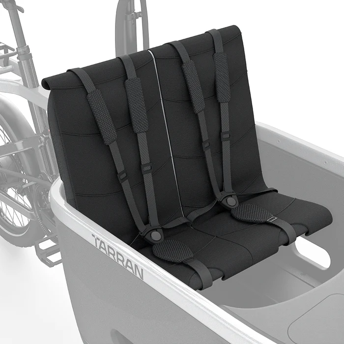 Child seat with 5-point safety harness from Tarran Bikes, featuring secure straps and durable frame for safe bike riding.